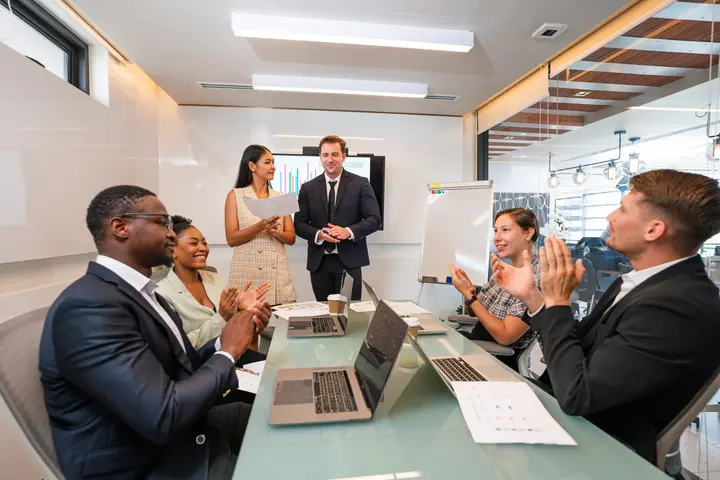Image of a person conducting a corporate meeting
